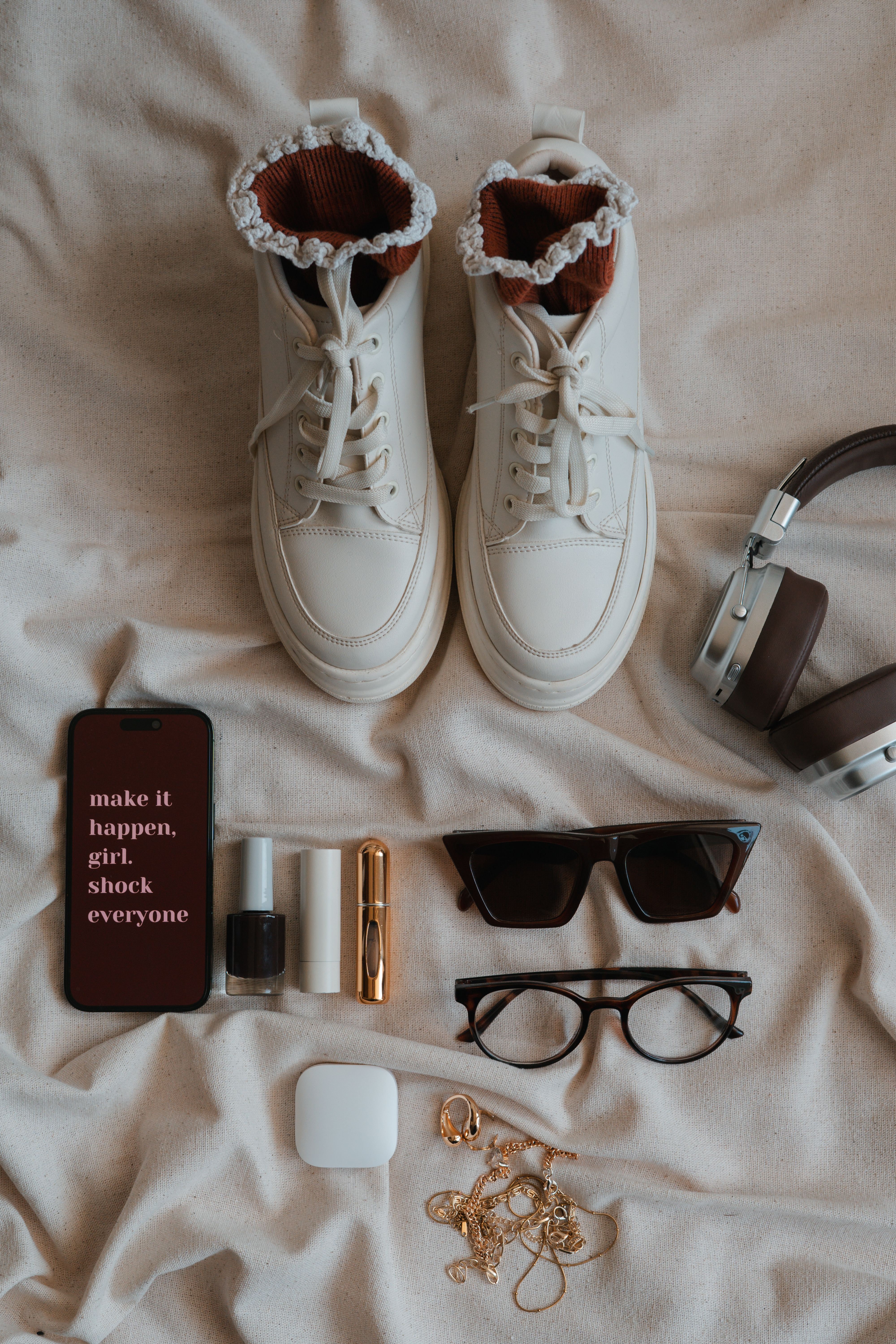 Footwear and accessories arranged as an editorial fashion flat lay